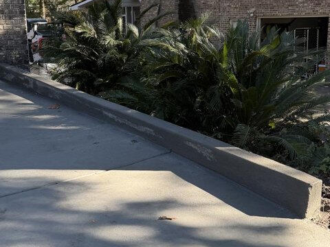 New concrete driveway with curb edge